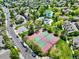 Community aerial view featuring tennis courts, lush landscaping, and residential streets at 3426 W 98Th W Dr # A, Westminster, CO 80031