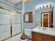 Well-lit bathroom with a shower-tub combo and classic fixtures, blending style and functionality at 3426 W 98Th W Dr # A, Westminster, CO 80031