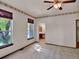 Bright bedroom with dual windows and a ceiling fan for optimal comfort, complemented by a floral wallpaper border at 3426 W 98Th W Dr # A, Westminster, CO 80031