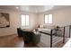 Well-lit living room featuring cozy seating and modern decor with hardwood floors at 2300 S Krameria St, Denver, CO 80222