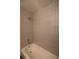 Updated shower with white subway tile, a chrome shower head, and classic design at 2300 S Krameria St, Denver, CO 80222