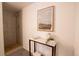 Updated shower featuring gray, stacked, horizontal tiles, a gray floor, and chrome shower head at 2300 S Krameria St, Denver, CO 80222