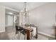 Elegant dining room with chandelier and wood table at 4200 W 17Th Ave # 311, Denver, CO 80204