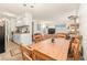 Bright dining area with kitchen and living room views at 7755 E Quincy Ave # 101, Denver, CO 80237