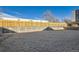 Community dog park with sand surface and privacy fencing at 4537 Tabor St, Wheat Ridge, CO 80033