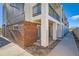 Rear view of townhouses showing brick and siding exteriors at 4537 Tabor St, Wheat Ridge, CO 80033