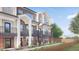 Two-story townhouses featuring balconies and a shared walkway at 4537 Tabor St, Wheat Ridge, CO 80033