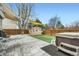 Backyard featuring an above ground hot tub, garden shed, and concrete patio at 10529 Vaughn Way, Commerce City, CO 80022