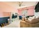 Cozy pink bedroom with a built in bookshelf and a window for natural light at 10529 Vaughn Way, Commerce City, CO 80022