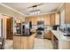 Modern kitchen with stainless steel appliances, a breakfast bar, and ample cabinet space at 10529 Vaughn Way, Commerce City, CO 80022