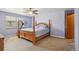 Bedroom with a four-poster bed, ceiling fan, and natural light coming in through the window at 11416 E 114Th Ave, Commerce City, CO 80640