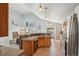 Spacious kitchen with an eat-in bar, hardwood floors, stainless steel appliances, and lots of natural light at 11416 E 114Th Ave, Commerce City, CO 80640