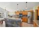 Modern kitchen with stainless steel appliances, granite countertops, and stylish cabinetry at 11416 E 114Th Ave, Commerce City, CO 80640