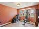 Workout room featuring an exercise machine, massage chair, and bay windows for natural light at 11416 E 114Th Ave, Commerce City, CO 80640