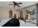 Bedroom featuring balcony access and a stylish bed with a plush comforter at 9546 Firenze Way, Highlands Ranch, CO 80126