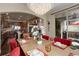 Bright formal dining room with an elegant chandelier and sliding glass door to a covered patio at 9546 Firenze Way, Highlands Ranch, CO 80126