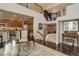 Open-concept living area showcasing staircase, hardwood floors, and a glimpse of the kitchen at 9546 Firenze Way, Highlands Ranch, CO 80126