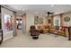 Comfortable living room features neutral decor and comfortable seating area with decorative pillows at 9546 Firenze Way, Highlands Ranch, CO 80126