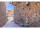 Cozy outdoor patio featuring brick accent wall and seating area, perfect for relaxation at 9546 Firenze Way, Highlands Ranch, CO 80126