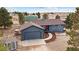 Charming single-Gathering home with detached garage, well-maintained landscape, and mature trees at 6200 Bow Meadows Dr, Elizabeth, CO 80107
