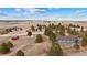 Extensive aerial perspective capturing the property amidst a mix of trees and open land with a red outbuilding at 6200 Bow Meadows Dr, Elizabeth, CO 80107