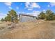 Backyard featuring well maintained landscaping, privacy and natural beauty at 6200 Bow Meadows Dr, Elizabeth, CO 80107