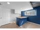 Finished basement features a built-in bar area and cabinets for storage at 6200 Bow Meadows Dr, Elizabeth, CO 80107