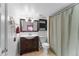 Bathroom with a wooden vanity, tiled floor and a shower and tub combo at 6200 Bow Meadows Dr, Elizabeth, CO 80107