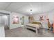 Bedroom with a queen sized bed, large mirror and access to the bathroom at 6200 Bow Meadows Dr, Elizabeth, CO 80107