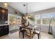 Inviting dining area with a sliding door to the outside and modern furnishings at 6200 Bow Meadows Dr, Elizabeth, CO 80107