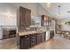 Bright kitchen featuring stainless steel appliances, granite countertops, and wood cabinets at 6200 Bow Meadows Dr, Elizabeth, CO 80107