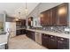 Modern kitchen features stainless steel appliances, granite countertops, and dark wood cabinetry at 6200 Bow Meadows Dr, Elizabeth, CO 80107
