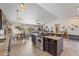 Open kitchen with granite countertops, stainless steel appliances, and an island with a gas range at 6200 Bow Meadows Dr, Elizabeth, CO 80107
