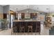 Well-appointed kitchen features an oversized island, sleek appliances, and lots of natural light at 6200 Bow Meadows Dr, Elizabeth, CO 80107