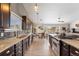 Beautiful kitchen featuring stainless steel appliances, granite countertops, and dark wood cabinets at 6200 Bow Meadows Dr, Elizabeth, CO 80107