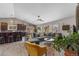 Bright living space offers a large sectional sofa, modern furnishings, and a view into the kitchen at 6200 Bow Meadows Dr, Elizabeth, CO 80107