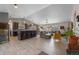 Open-concept living space features a seamless transition between kitchen, dining, and living areas at 6200 Bow Meadows Dr, Elizabeth, CO 80107