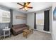 Cozy sitting area with neutral decor, a ceiling fan, and lots of natural light through the window at 6200 Bow Meadows Dr, Elizabeth, CO 80107