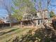 View of the backyard and deck, showcasing the outdoor living space and well-maintained lawn at 5115 S Valdai St, Aurora, CO 80015