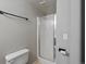 Small bathroom with a toilet and a shower with translucent glass door at 5115 S Valdai St, Aurora, CO 80015