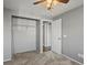 Bedroom featuring gray carpet, ceiling fan, and standard closet with natural light at 5115 S Valdai St, Aurora, CO 80015
