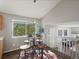 Cozy dining area features a round table, four chairs, and natural light at 5115 S Valdai St, Aurora, CO 80015