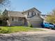 Charming two-story home with a well-manicured lawn and a welcoming front porch at 5115 S Valdai St, Aurora, CO 80015