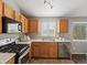 Efficient kitchen with stainless steel appliances and ample counter space at 5115 S Valdai St, Aurora, CO 80015