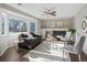 Inviting living room with a fireplace, large windows, and comfortable seating at 5115 S Valdai St, Aurora, CO 80015