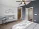 Main bedroom with bench, accent wall, and ensuite bathroom featuring a tiled shower at 5115 S Valdai St, Aurora, CO 80015