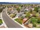 Well-maintained home with lush lawn, garden, fenced yard, and mature trees at 705 Prairie Ridge Rd, Highlands Ranch, CO 80126