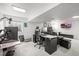 Finished basement office with large TV and lighting at 705 Prairie Ridge Rd, Highlands Ranch, CO 80126