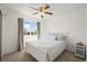Comfortable bedroom with a window view and ceiling fan at 705 Prairie Ridge Rd, Highlands Ranch, CO 80126