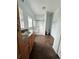 Bathroom featuring a shower, vanity, and wood-look vinyl flooring at 7811 St Vrain Dr # 68, Frederick, CO 80530